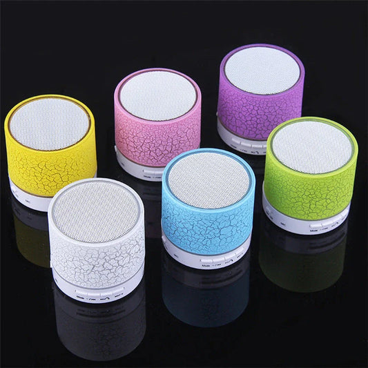 Compact wireless Bluetooth speakers in various colours, featuring premium audio components and sleek, durable design