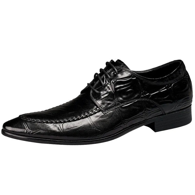 Black men's leather casual shoes with alligator pattern and metal horse bit buckle on a rubber sole.