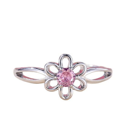 Women's flower hollow ring in pink diamond colour with floral design on copper band