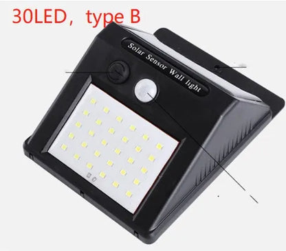 Solar-powered outdoor garden lamp with motion sensor mounted on wooden post