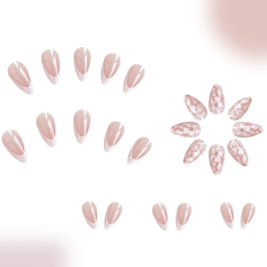 Short glossy almond false nails with glittering powder flower designs in C625 colour