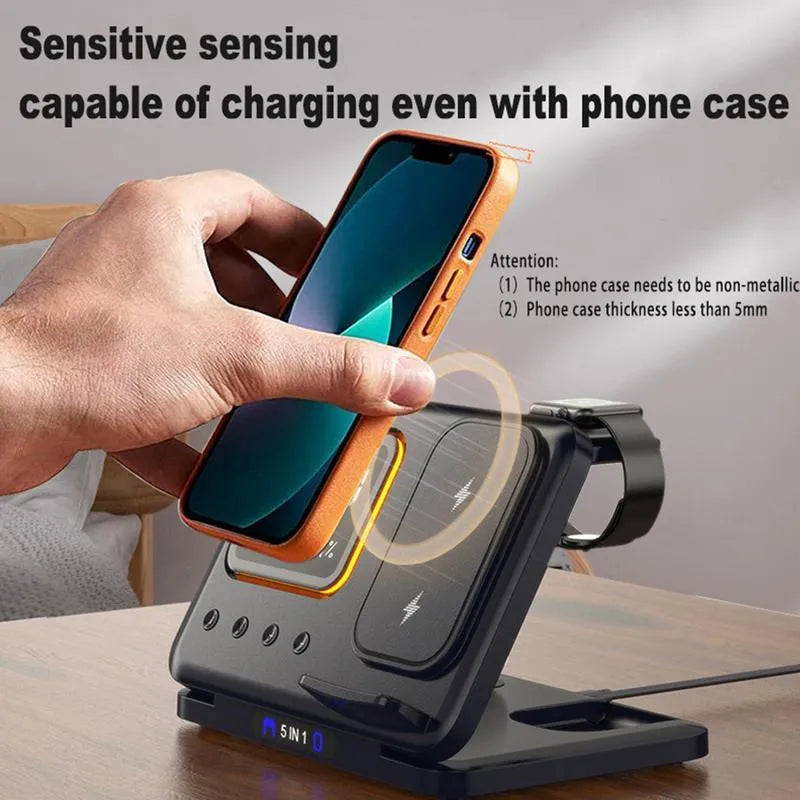 Black wireless charging station showing phone, watch and headphones charging, with digital clock display.