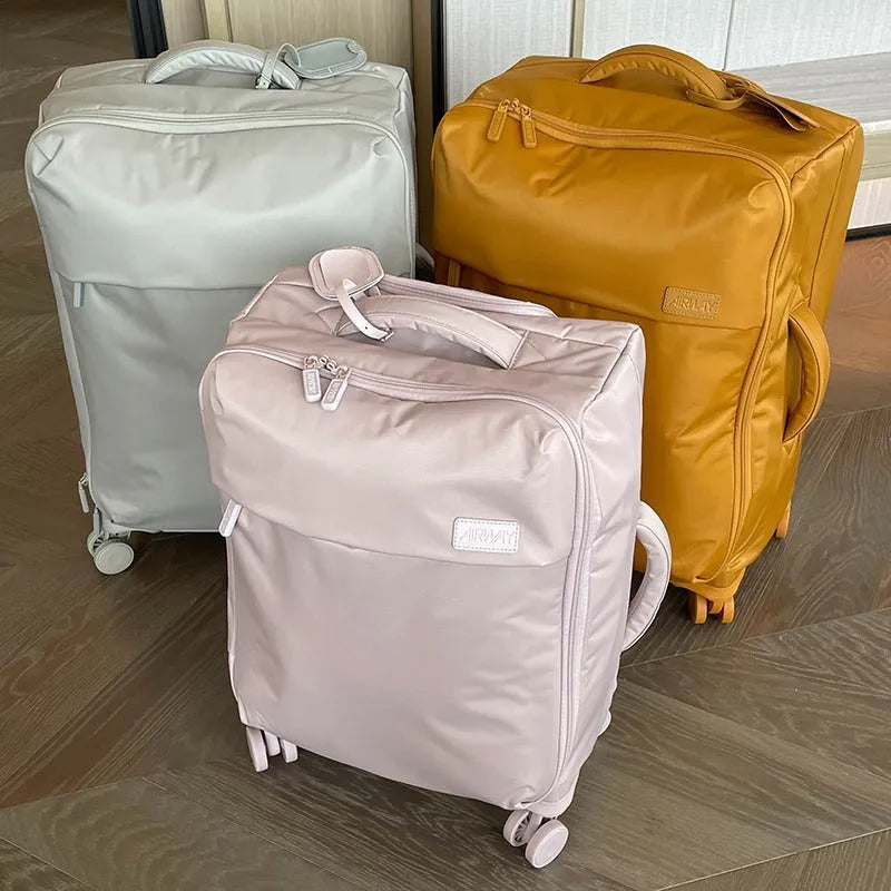Ultra-light waterproof Oxford cloth suitcase in bluestone green with universal wheels showing 20-inch size dimensions