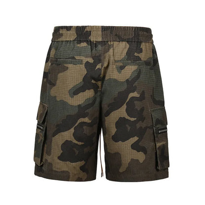 Green H215 washed camouflage cotton workwear shorts on a mid-waist, loose-fit model