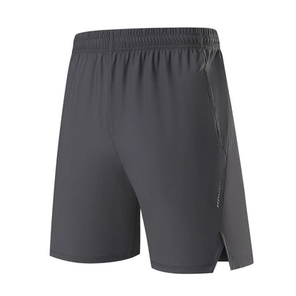Men's black nylon sports shorts with mid-waist, shown flat.