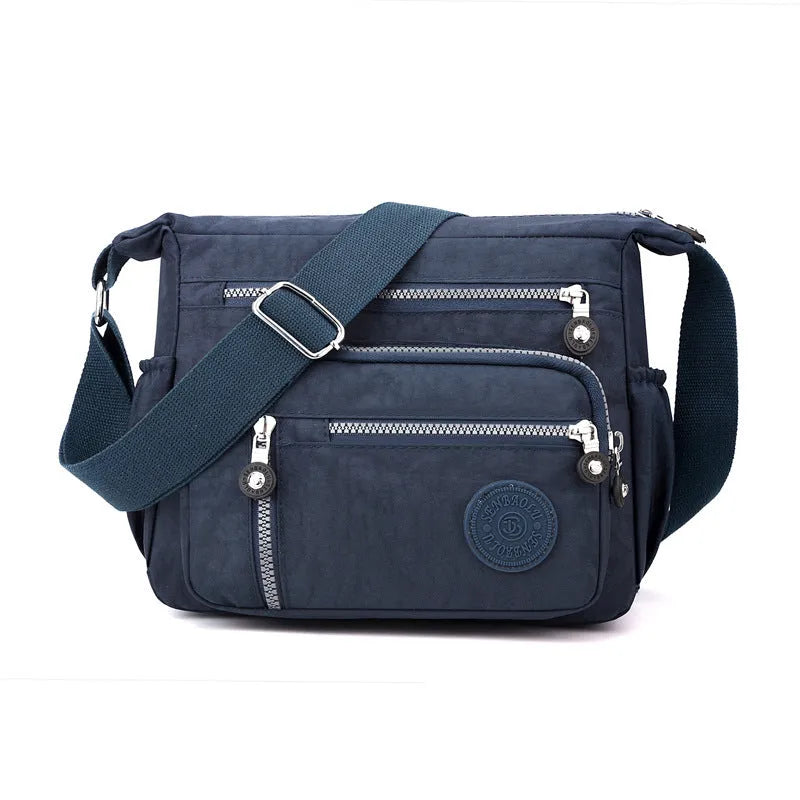 Soft nylon messenger bag in square vertical shape with adjustable shoulder strap