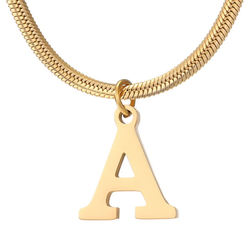 Elegant gold A-Z letter pendant necklace on a snake chain