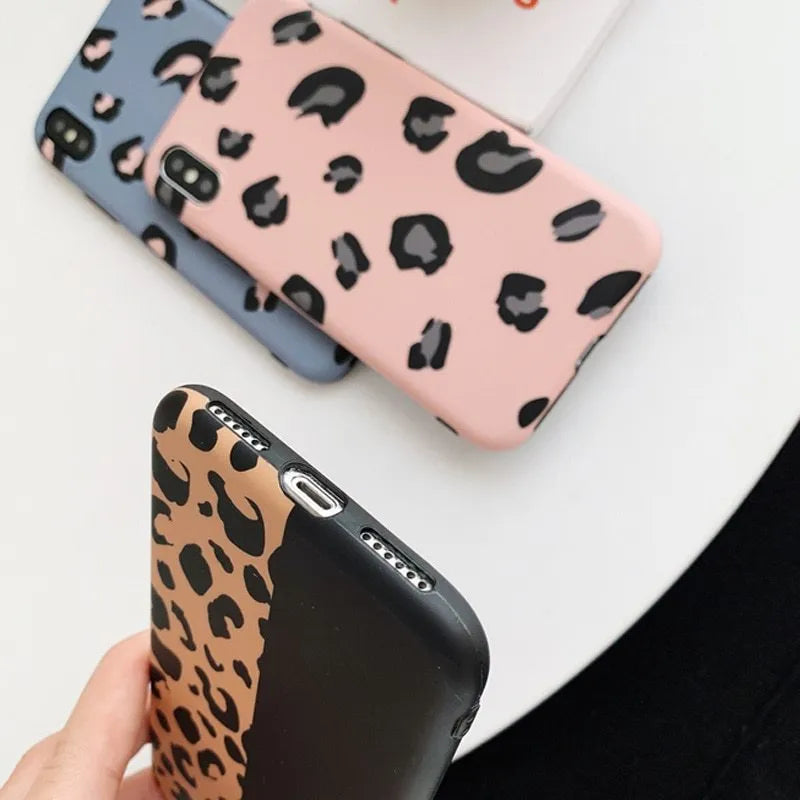 Leopard print protective phone case for iPhone, shown in black, blue, and pink colour options.