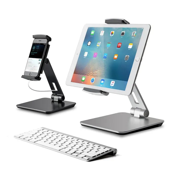 Silver folding phone and tablet stand holding a device, showing its 360-degree rotation and compact size