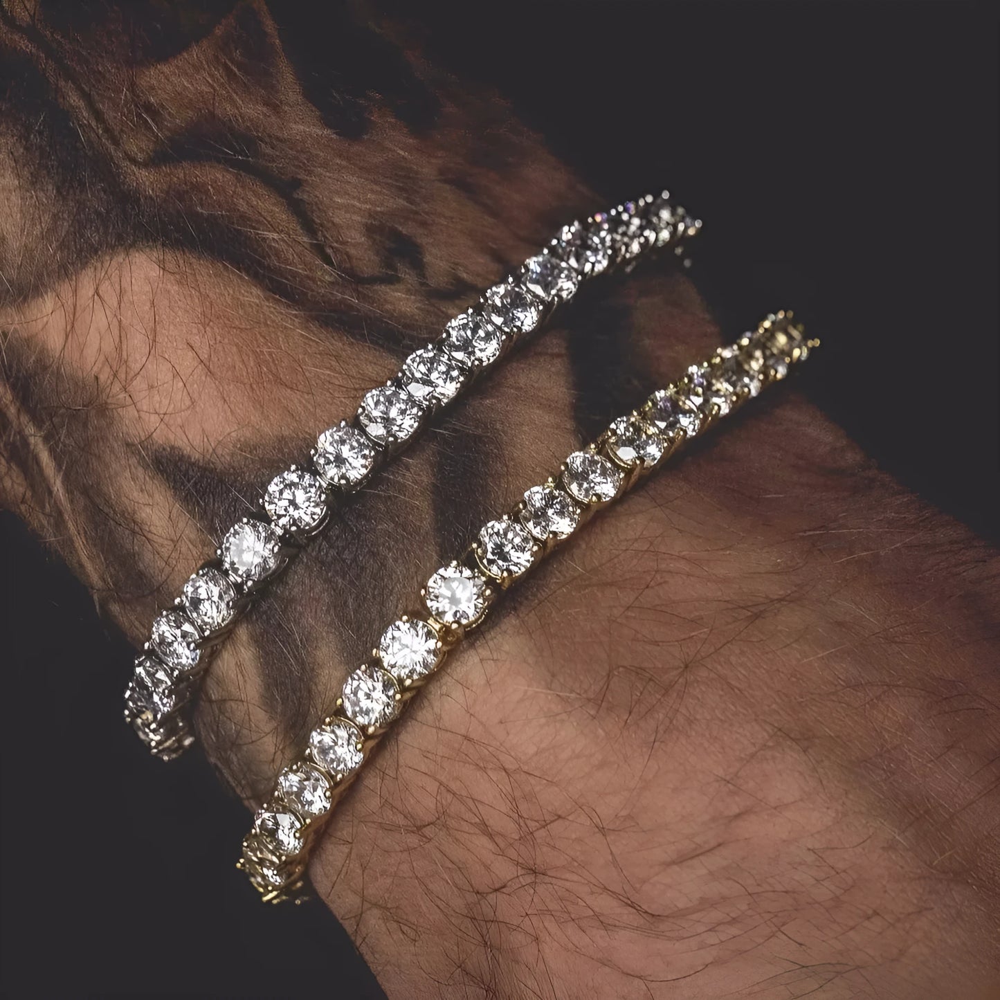 Men's silver alloy link bracelet with a row of clear rhinestones, shown on a wrist.