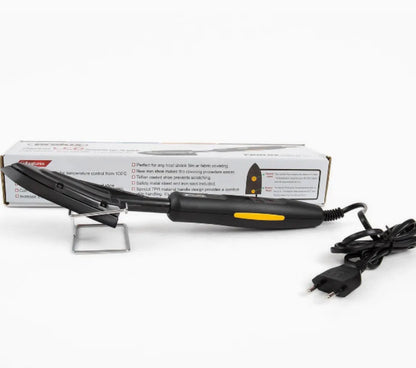 Electronic temperature control iron for styling wigs and hairpieces with metal barrel and PTFE soleplate.