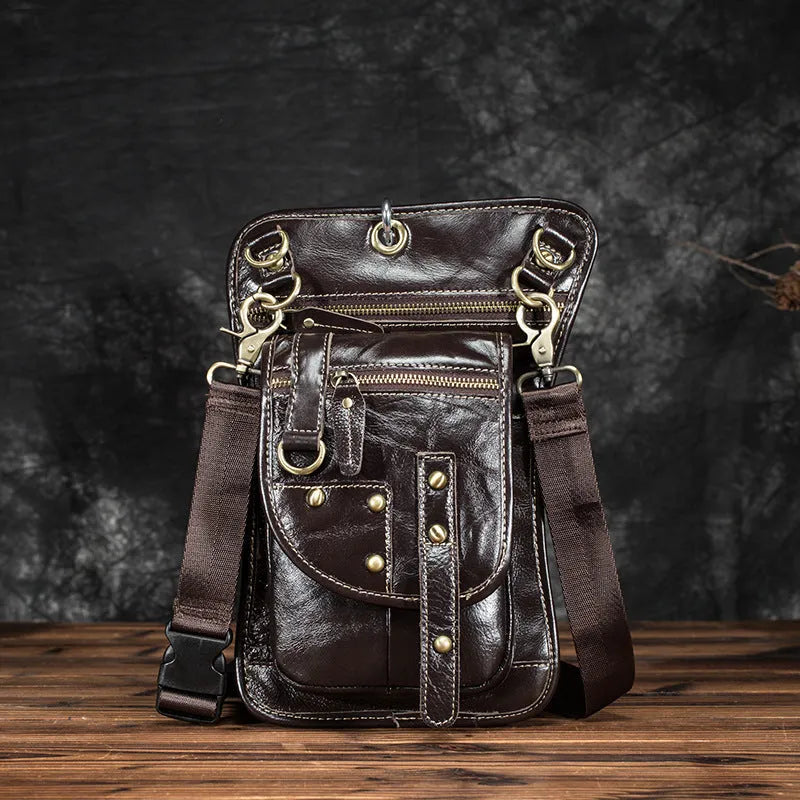 Men's black genuine cowhide leather fanny pack with zipper open showing internal phone and ID compartments