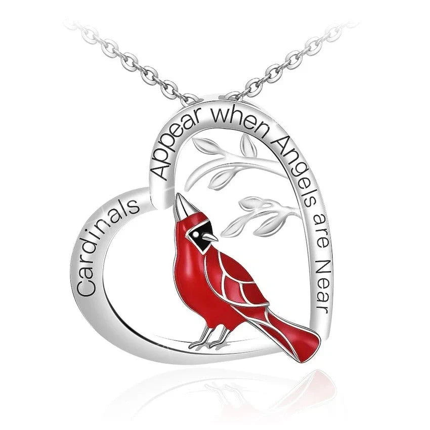 Elegant heart-shaped cardinal pendant necklace with a silver finish, perfect for gifting.