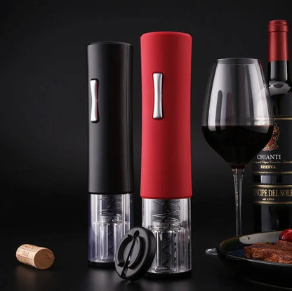Black electric wine opener with transparent cover and aluminum foil cutter on wooden table