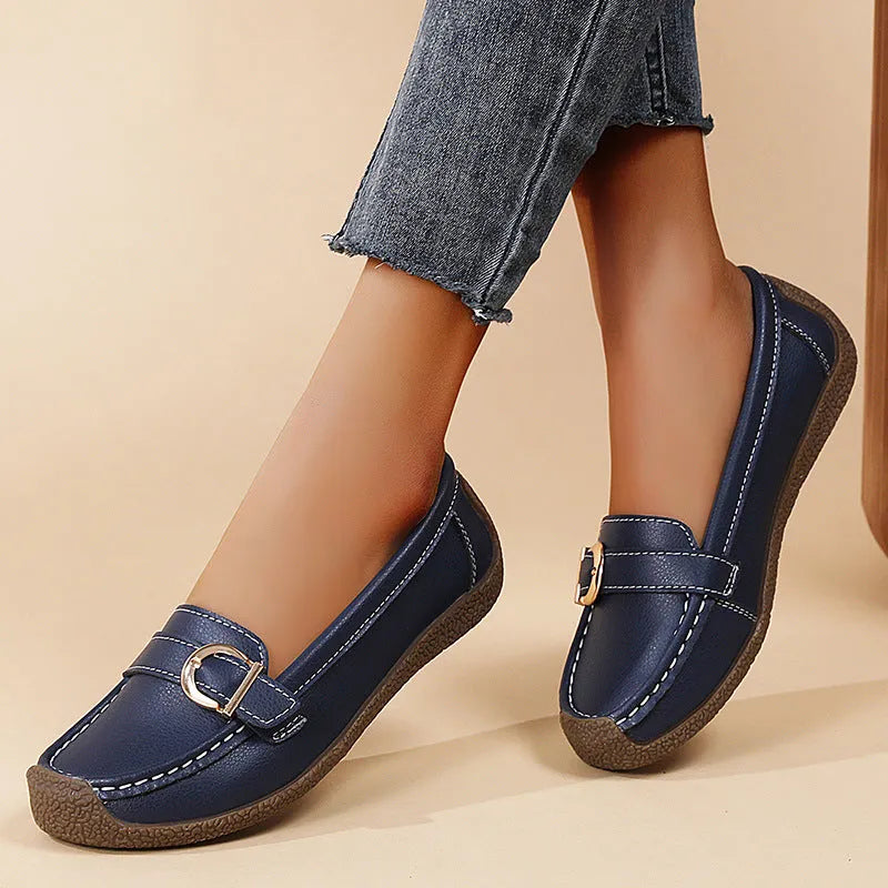 Women's beige casual loafers with a round toe and shallow-cut vamp on a beef tendon sole.