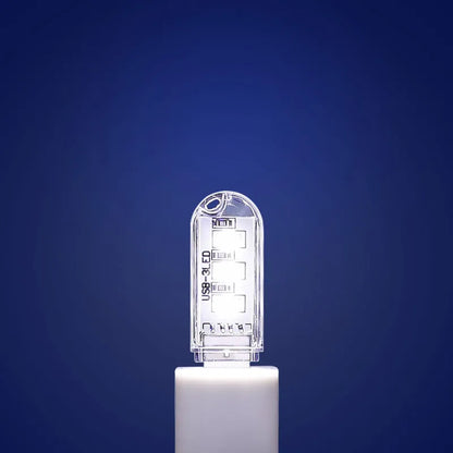 Small white USB LED baby night light showing warm and white light colour options.