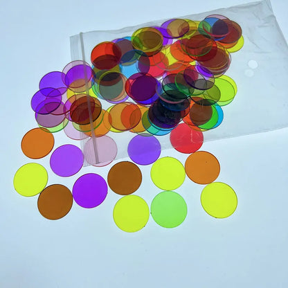 Bag of 100 plastic counting chips in 19mm or 25mm size, solid colour or transparent, for children aged 4 to 6