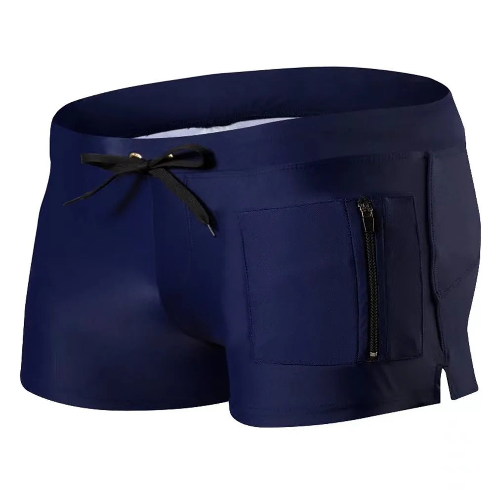 Men's black high-waisted swimming trunks with a lace-up front closure, shown on a model.