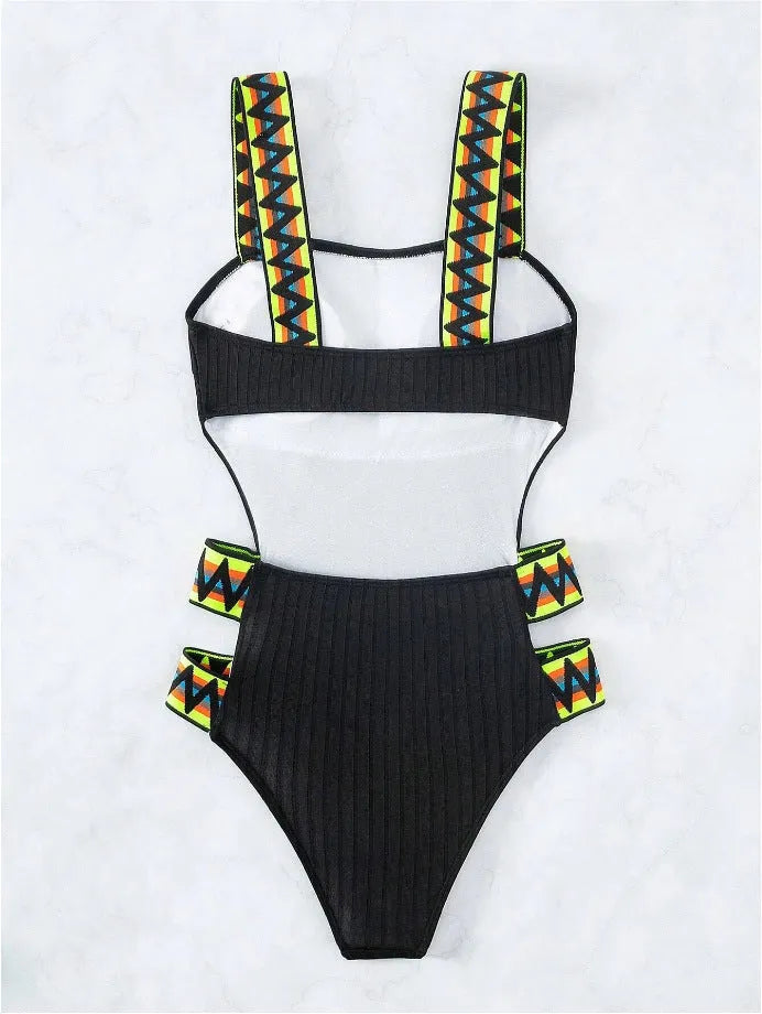 Women's one-piece swimming suit bikini in solid black or orange, made from polyester fabric, showing front view
