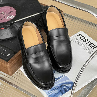 Classic black slip-on Derby leather shoes for men and women on a plain background