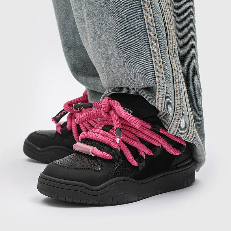 Low-top unisex casual shoes in denim blue with a round toe, thick rubber sole, and front lace-up closure.