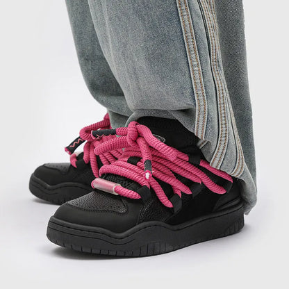 Low-top unisex casual shoes in denim blue with a round toe, thick rubber sole, and front lace-up closure.