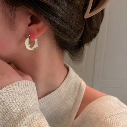 Stylish geometric earrings with dripping glaze in candy colours, perfect for adding a modern touch to any outfit.