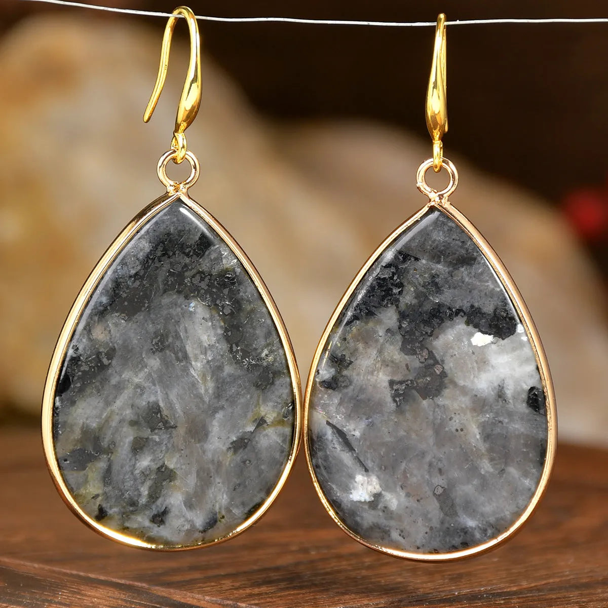 Women's retro-style drop earrings with a natural stone pendant in a water drop shape on an electroplated setting.