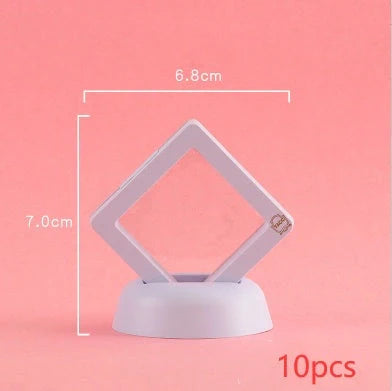 3D floating jewelry coin display stand in white and black, showcasing collectibles in mid-air