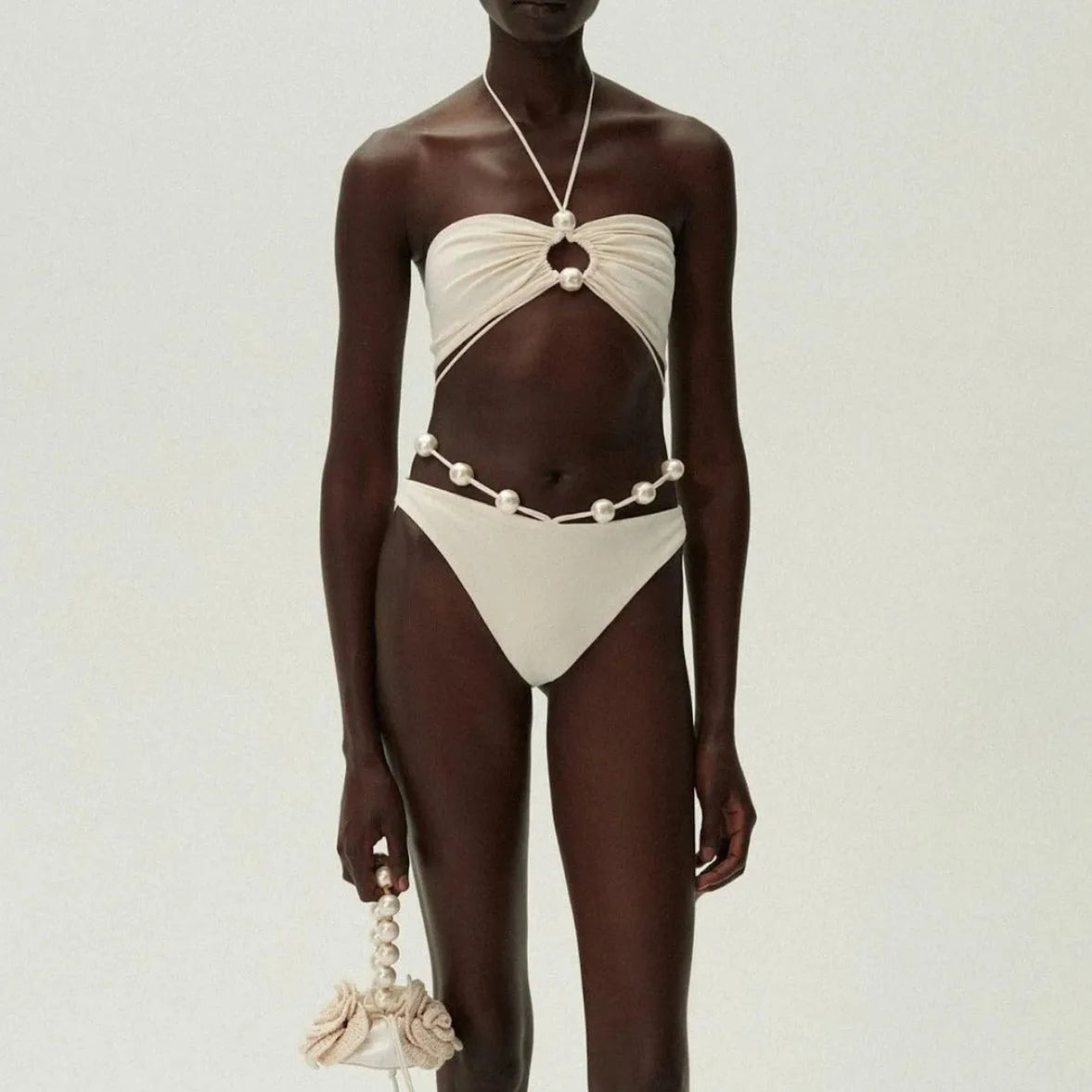 Women's black lace-up bikini swimsuit showing adjustable design and two-piece construction