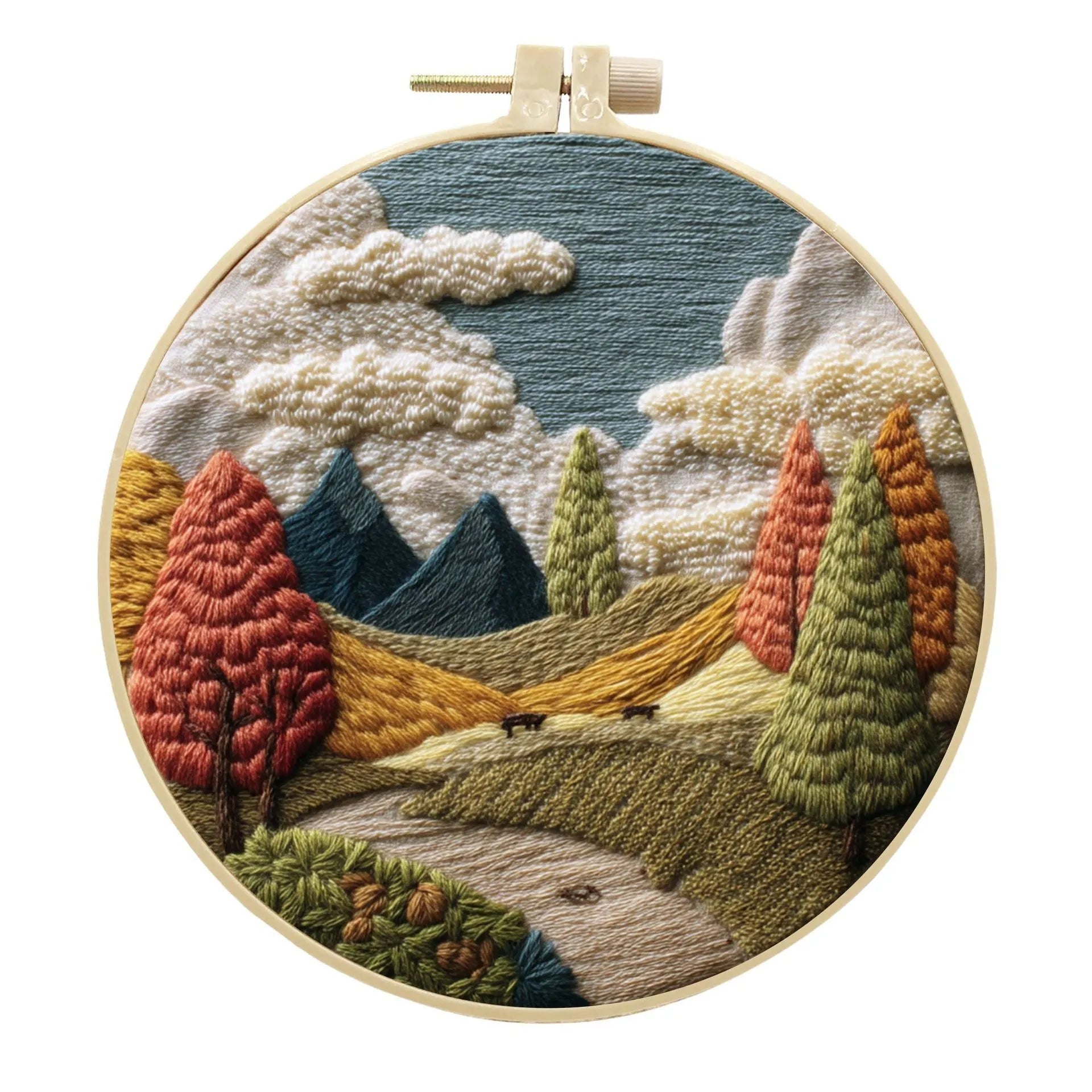 Complete DIY embroidery kit with 15cm bamboo frame, pre-printed landscape fabric, threads, and needles laid out.