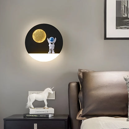 Astronaut-shaped wall lamp with small shelf in black or white finish for bedside placement