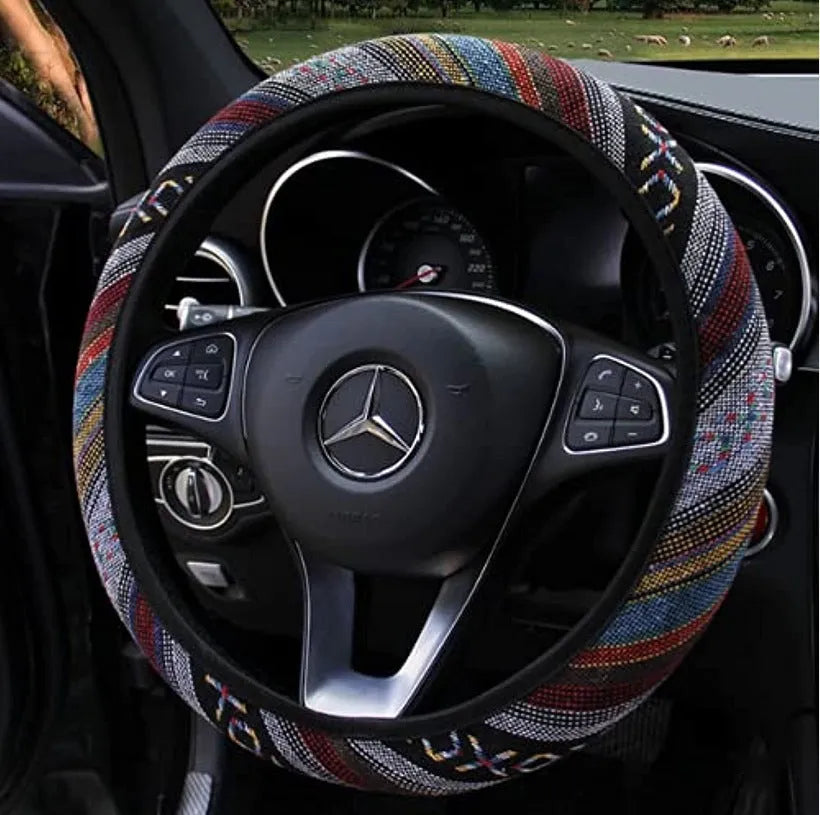 Short plush steering wheel cover in one of seven colours, fitting a 38cm steering wheel with non-slip grip