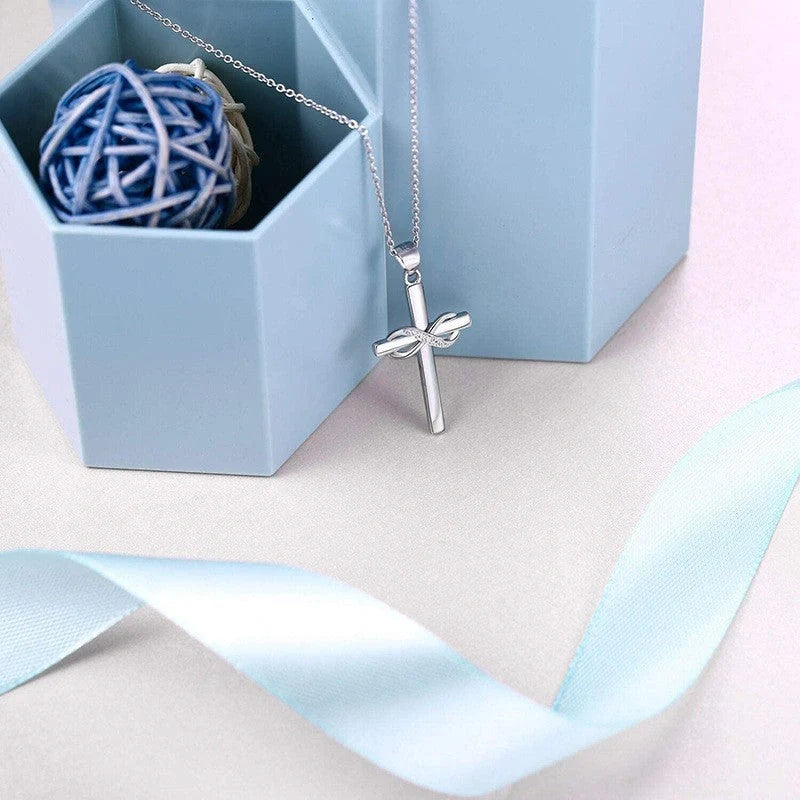 Elegant gold cross and infinity pendant necklace for women, showcasing timeless beauty and spiritual meaning.