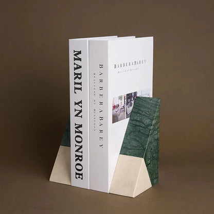 A pair of natural green marble bookends with a retro travertine finish, standing upright and supporting books on a shelf.