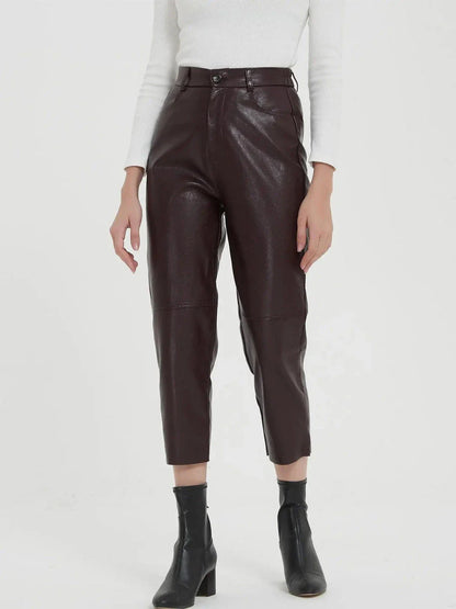 Elegant faux leather pants with high waist and ankle-length design, perfect for office or casual wear.