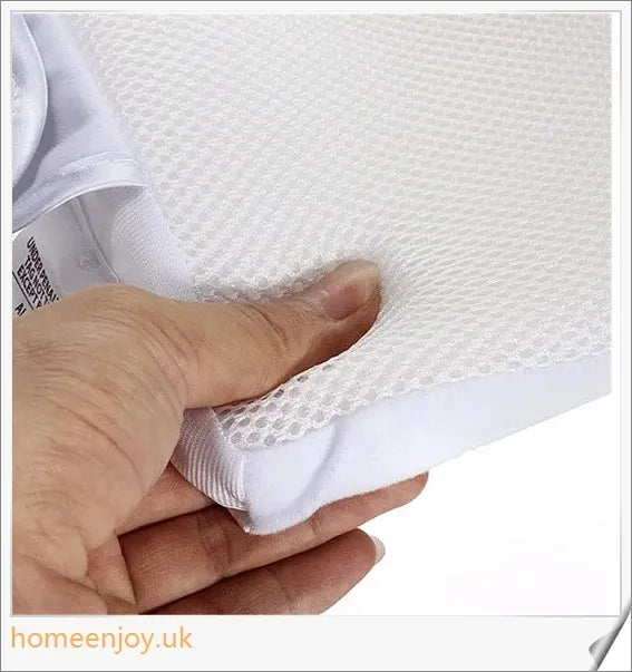 A premium baby sleep pillow with elevated head position, air vents, and breathable mesh fabric for comfortable, safe slumber.