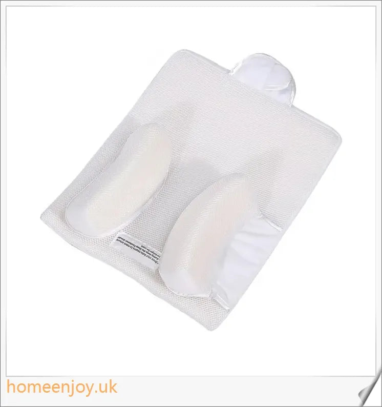A premium baby sleep pillow with elevated head position, air vents, and breathable mesh fabric for comfortable, safe slumber.