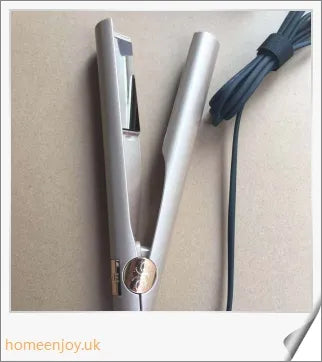 A sleek and versatile 2-in-1 hair straightening and curling iron with adjustable temperature settings
