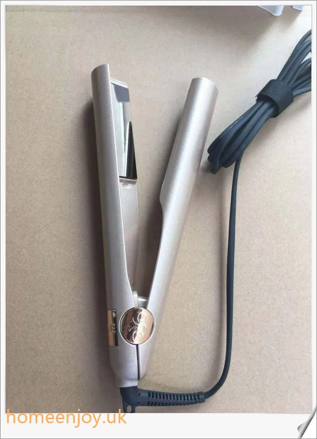 A sleek and versatile 2-in-1 hair straightening and curling iron with adjustable temperature settings