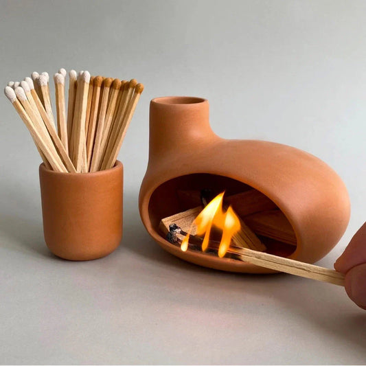 Elegant and modern ceramic incense burner with Palo Santo wood holder, designed to enhance your living space with a calming aroma.
