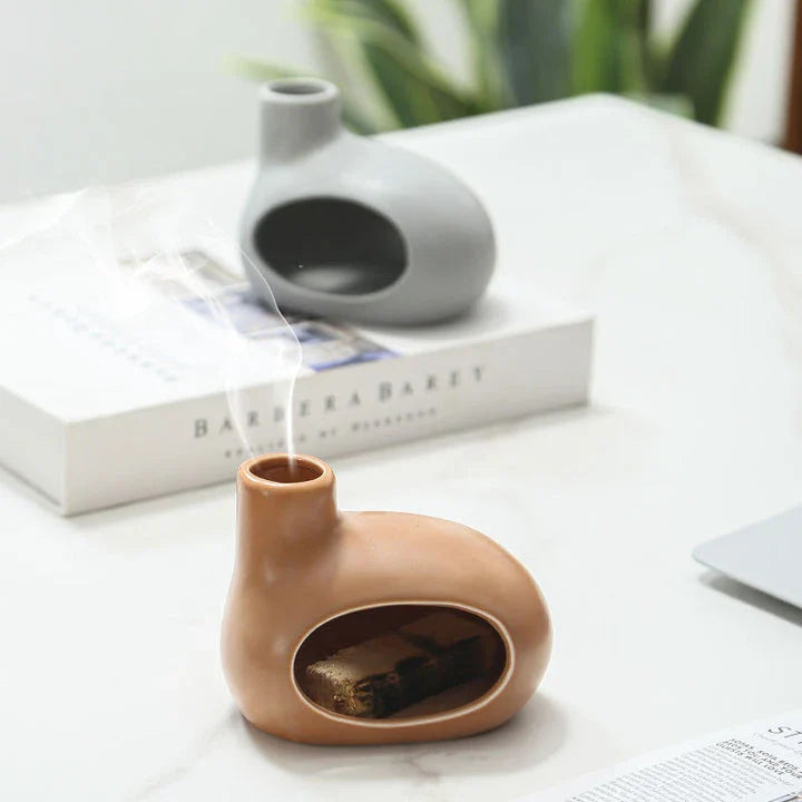 Elegant and modern ceramic incense burner with Palo Santo wood holder, designed to enhance your living space with a calming aroma.