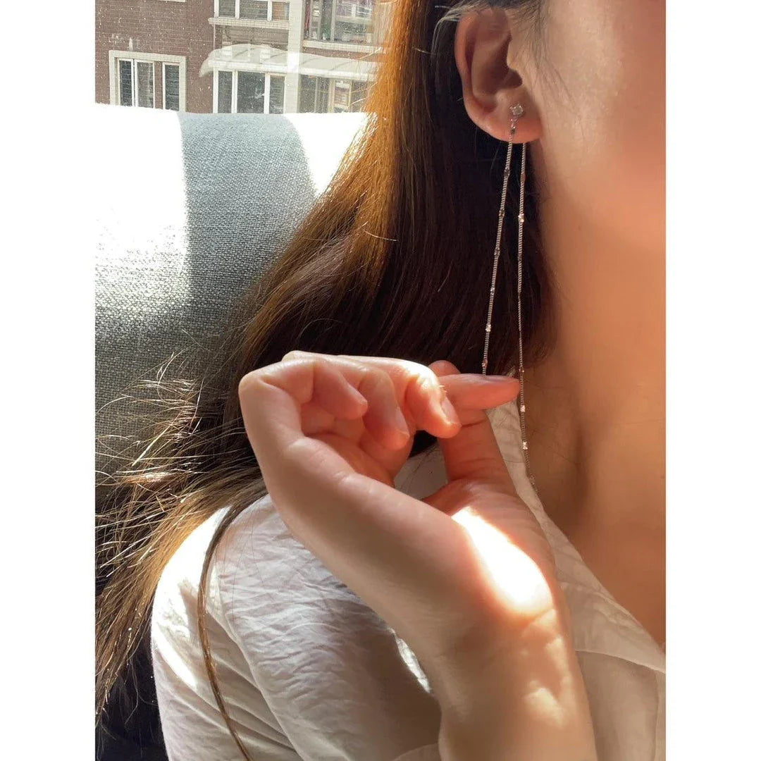 Elegant long tassel sequin earrings in silver, inspired by the Han Dynasty