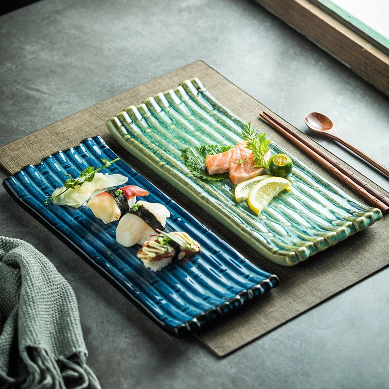 A rectangular ceramic plate with a beautiful kiln-baked blue finish, perfect for serving pizzas, cheese boards, and more.
