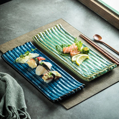 A rectangular ceramic plate with a beautiful kiln-baked blue finish, perfect for serving pizzas, cheese boards, and more.