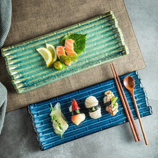 A rectangular ceramic plate with a beautiful kiln-baked blue finish, perfect for serving pizzas, cheese boards, and more.