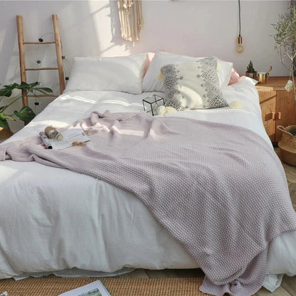 Cosy oversized moss stitch knitted blanket in a variety of elegant colours, perfect for adding comfort and style to your living space.