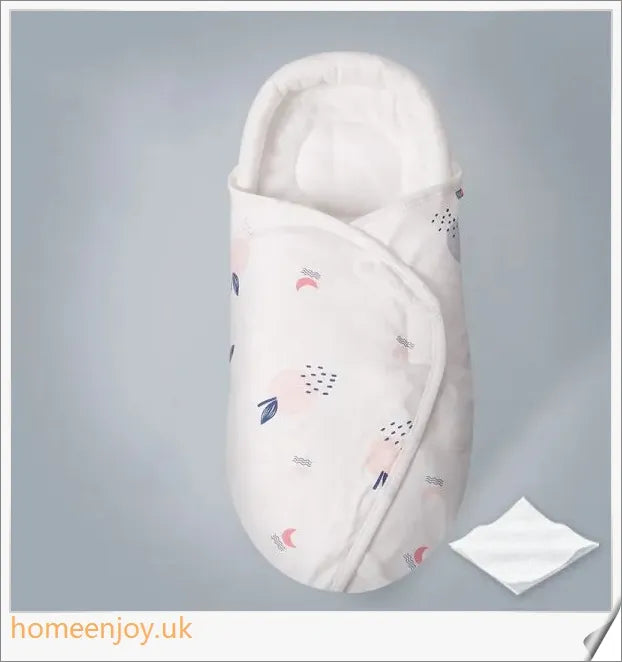 A cozy, snug baby swaddle with soft cotton fabric and velcro closures to provide comfort and security for newborns.