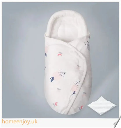 A cozy, snug baby swaddle with soft cotton fabric and velcro closures to provide comfort and security for newborns.