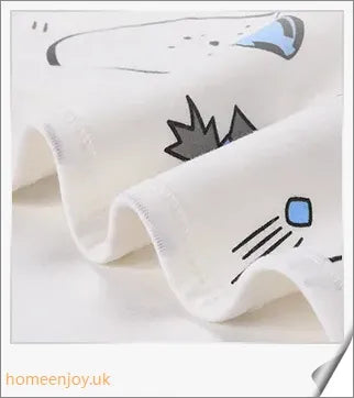 A cozy, snug baby swaddle with soft cotton fabric and velcro closures to provide comfort and security for newborns.